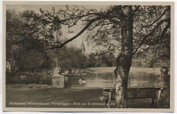 AK Foto Nordseebad Wilhelmshaven Parkanlagen Blick zur St. Willehad-Kirche 1930