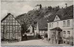 AK Foto Schwalenberg in Lippe Einfahrt zum Städtchen und die Burg 1957