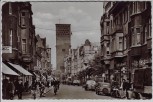 AK Foto Leverkusen Wiesdorf Hauptstraße viele Menschen Autos Geschäfte 1953